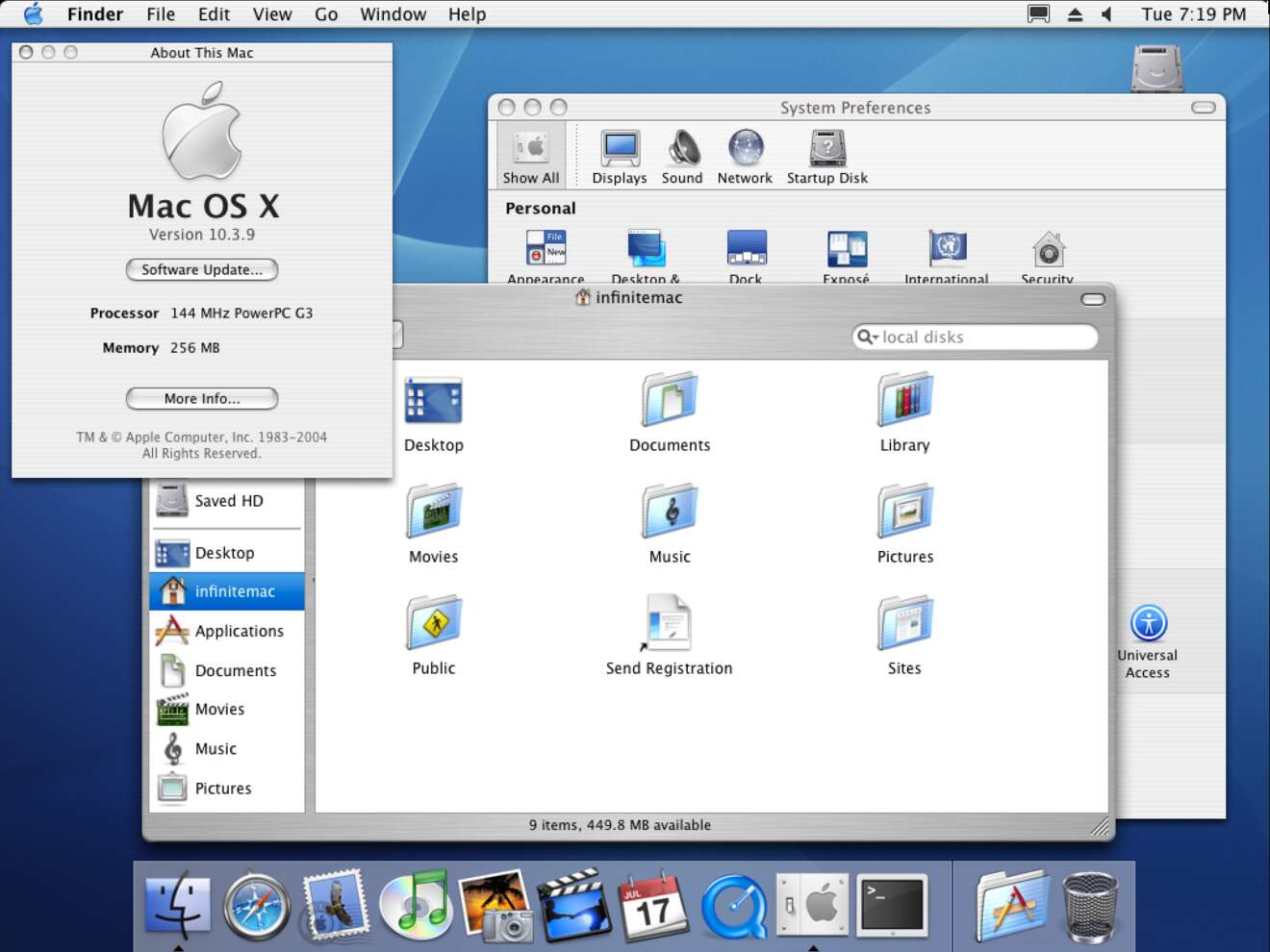 Screenshot of Mac OS X 10.3 from Infinite Mac running in Firefox on Linux. The About This Mac window is open, along with Finder and System Preferences.
